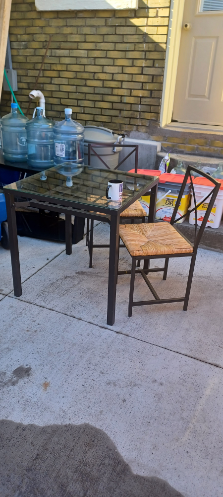 Metal patio table and two chairs