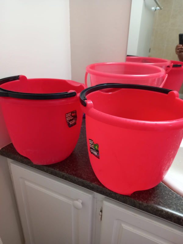 Three Pink Plastic Buckets