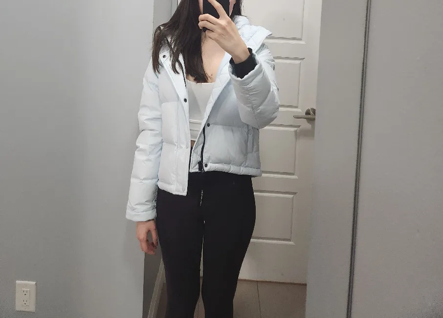 The Super Puff Light Blue Cropped Puffer Jacket with a tag image indicator(3)