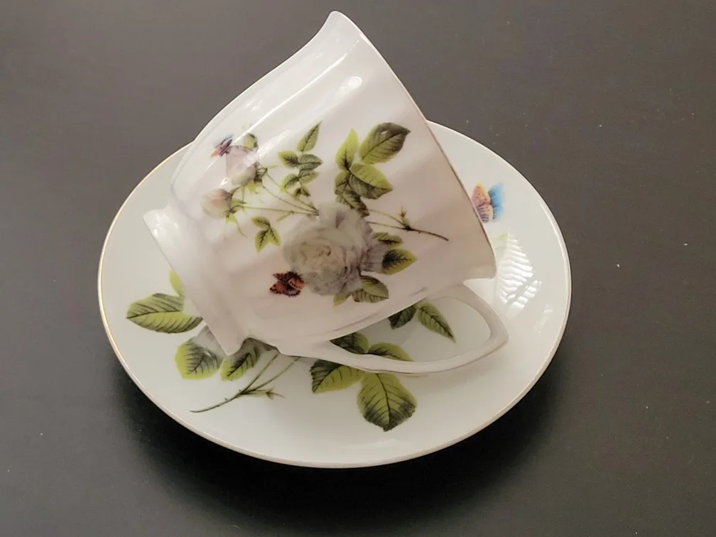 Teacup and Saucer Set with Floral Design image indicator(2)