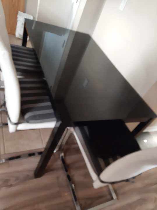 Black Glass Dining Table with four chairs