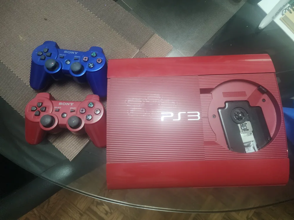 Sony PlayStation 3 Slim Console with 2 Controllers image indicator(6)