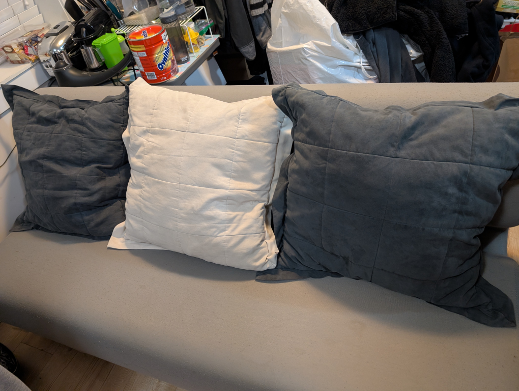 Grey Three-Seater Sofa with Pillows