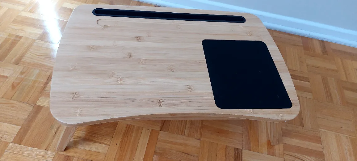 Portable bamboo laptop table. Features a phone/tablet holder image indicator(2)