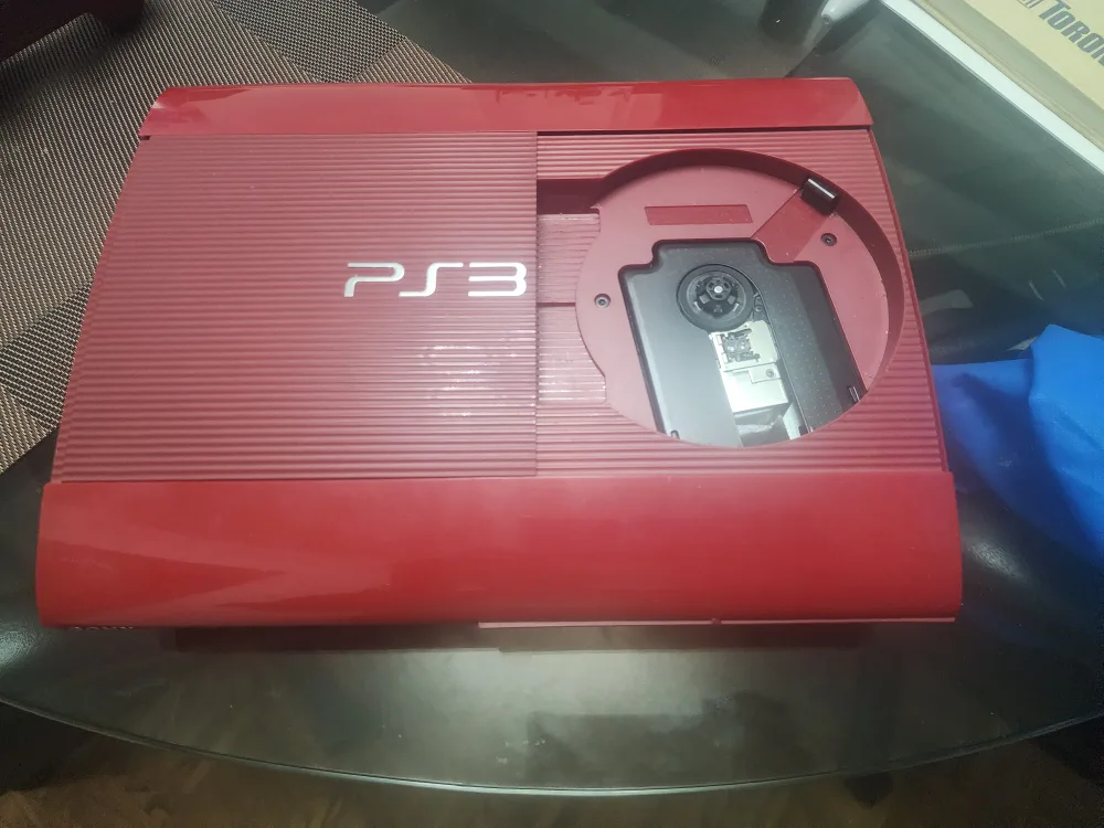 Sony PlayStation 3 Slim Console with 2 Controllers image indicator(2)