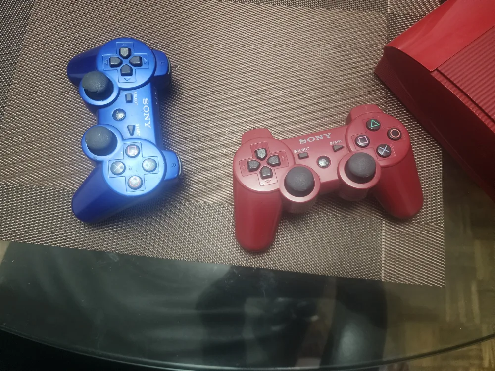 Sony PlayStation 3 Slim Console with 2 Controllers image indicator(3)