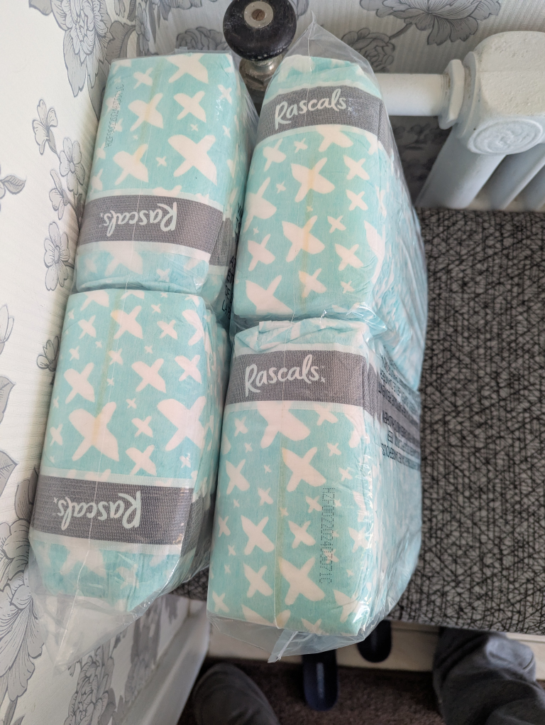 Four packs of Rascals diapers