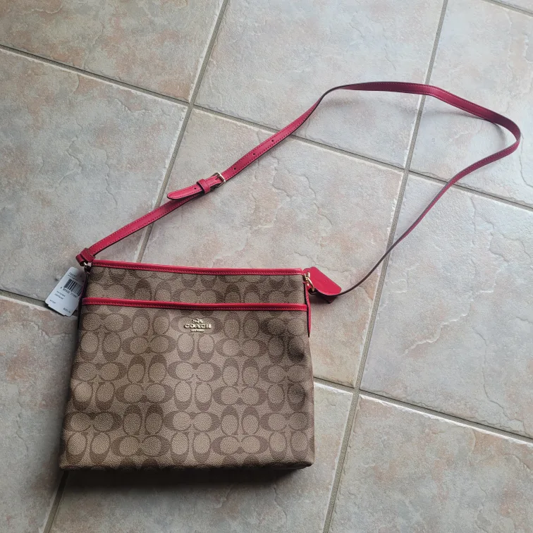 Coach crossbody bag, brown signature canvas with pink accents image indicator(7)