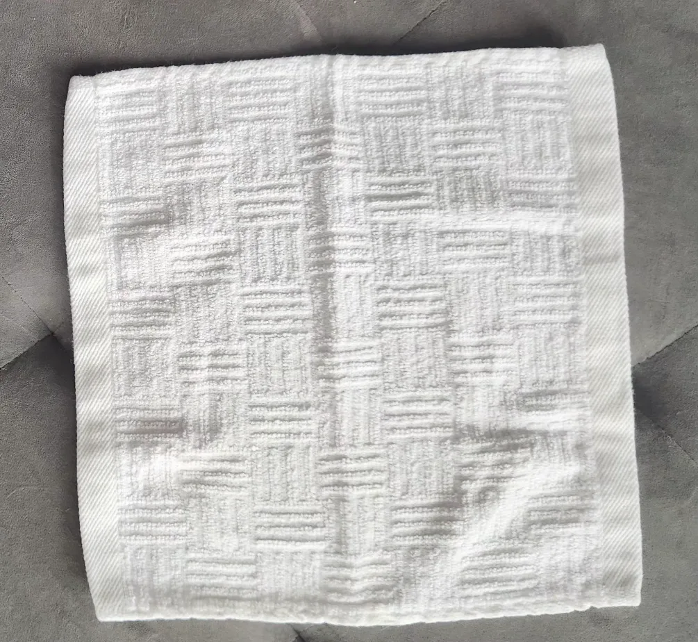 Trio of White Textured Washcloths image indicator(4)