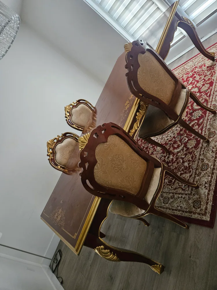 Dining table with chairs and rug image indicator(2)