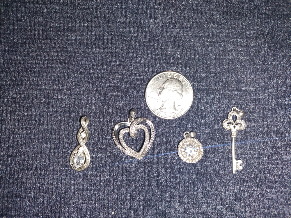 four 925 Silver Pendant sold as set