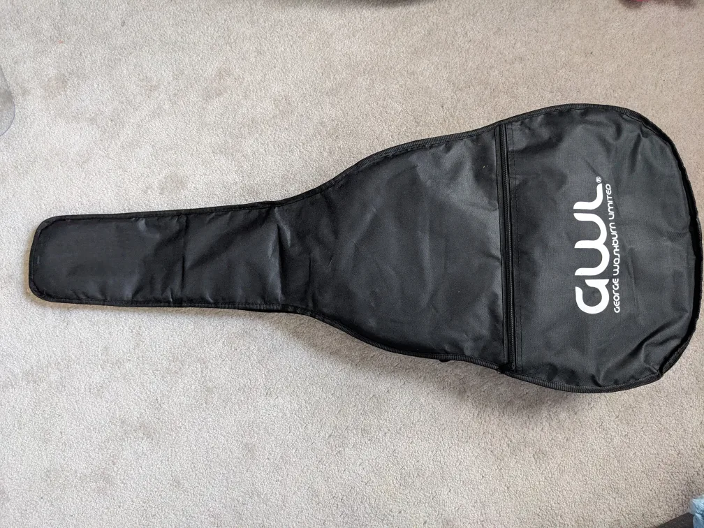 Acoustic guitar with: case, tuner, pick, new strings image indicator(6)