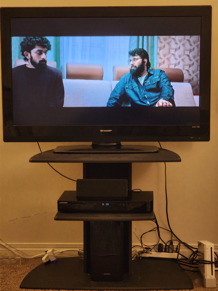 Sharp TV with Samsung Soundbar and Stand