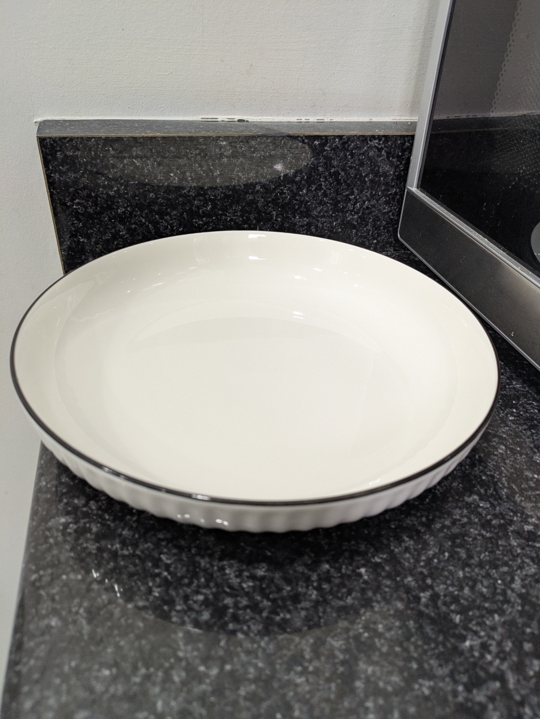 White fluted ceramic baker