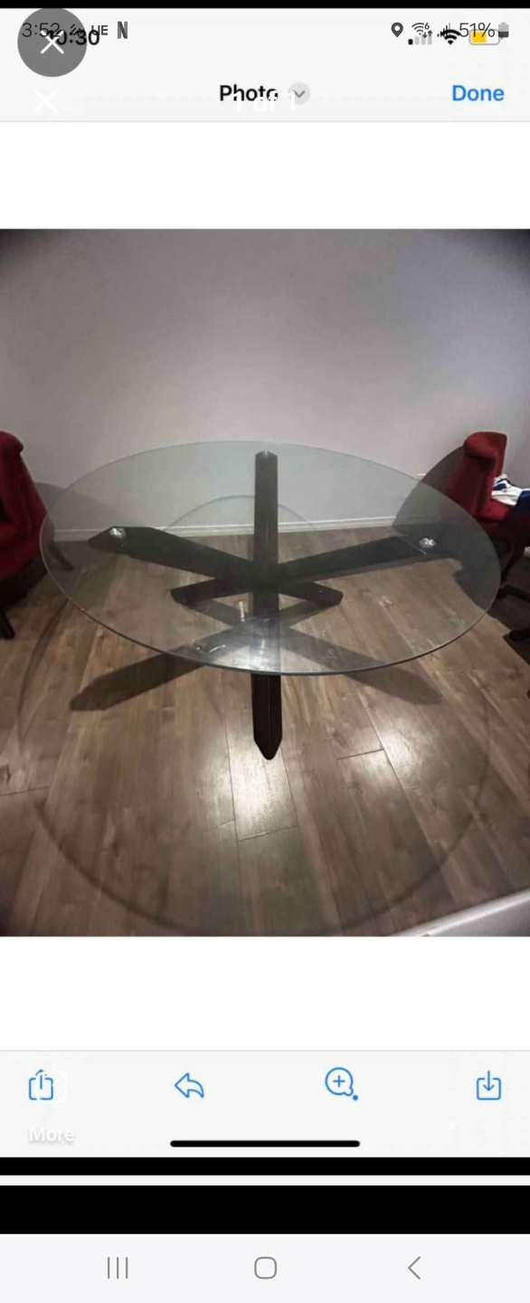 Glass-top dining table