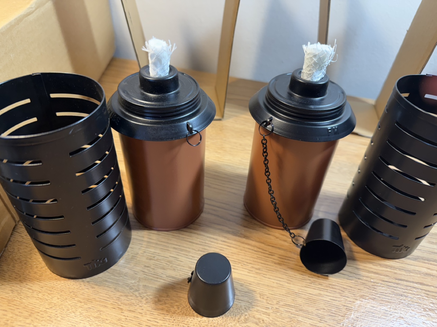 Two Tiki Torches with Metal Sleeves and Stands
