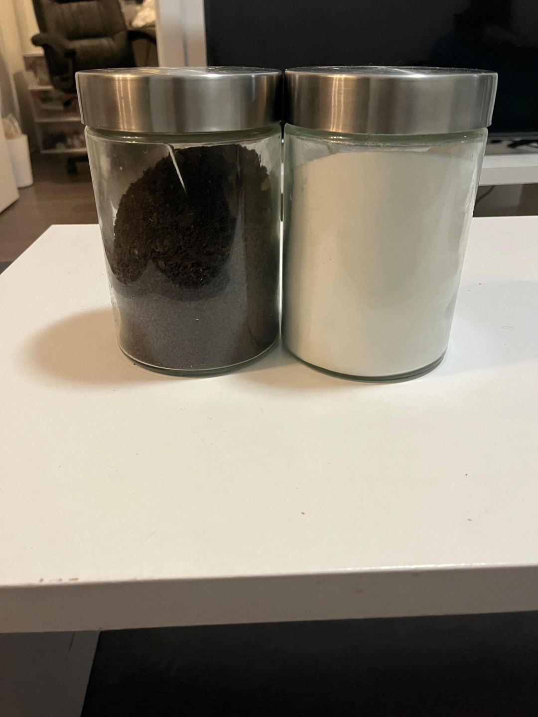 Two Glass Canisters with Metal Lids