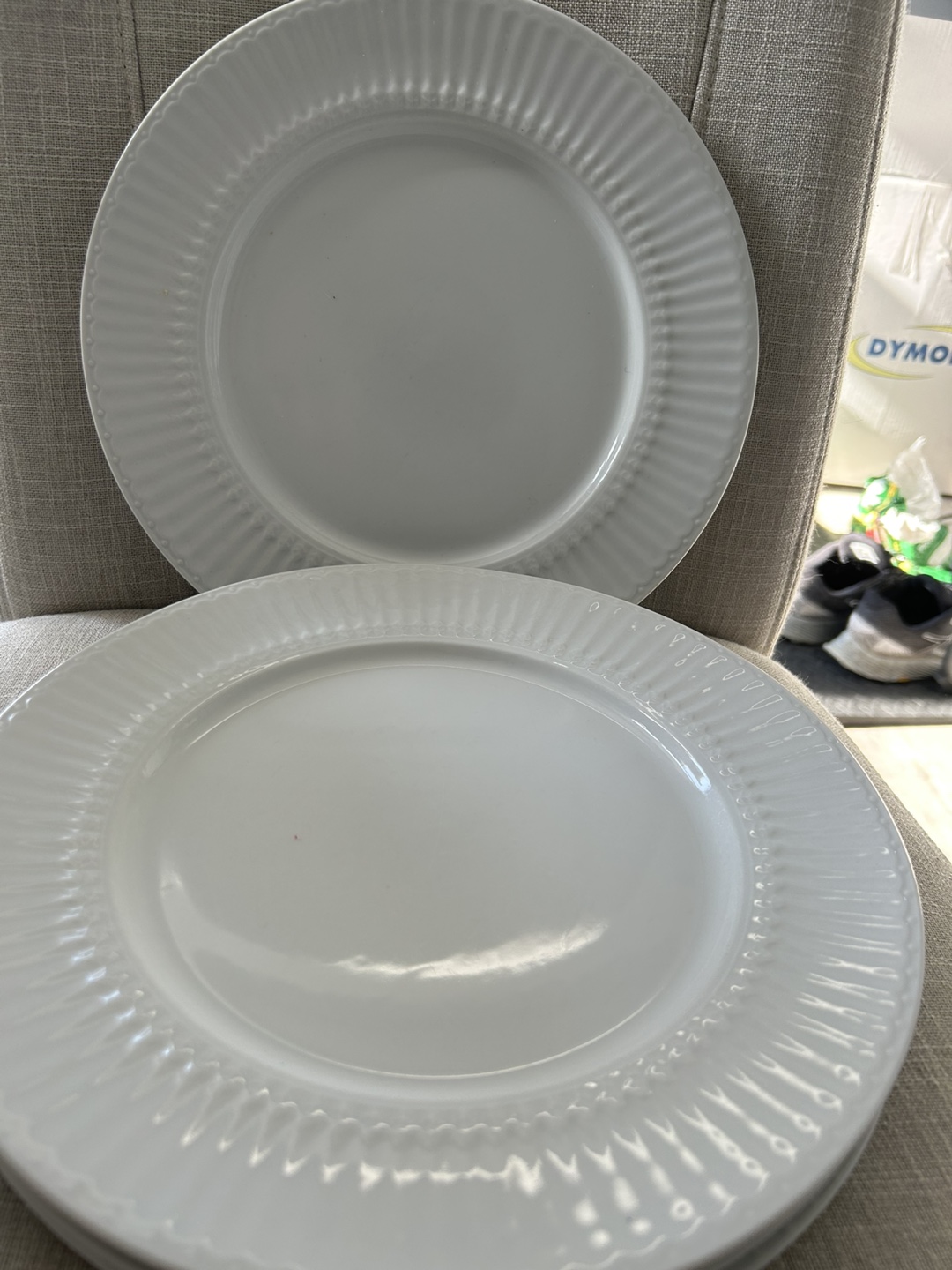 Set of four white dinner plates