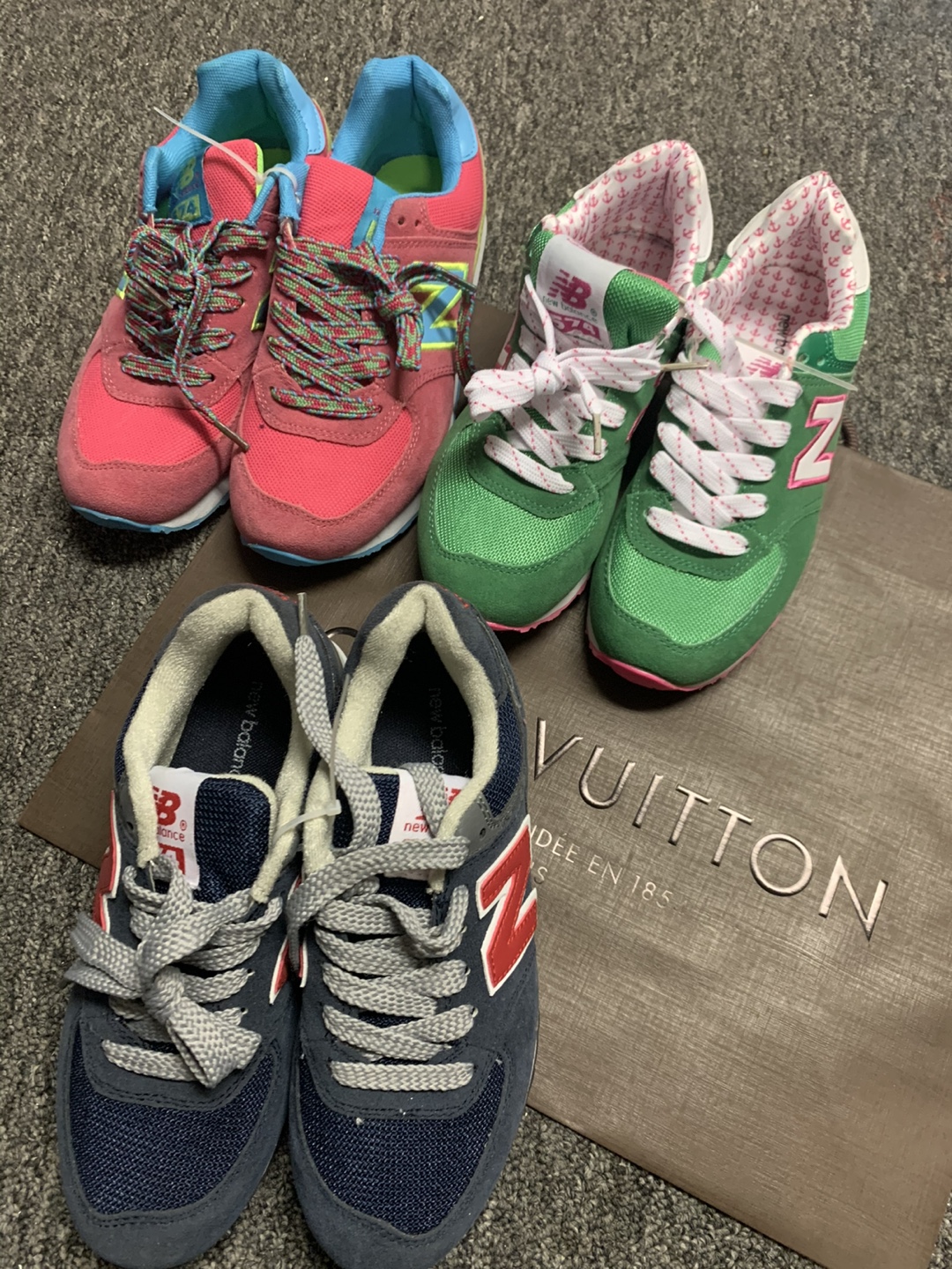 Three pairs of New Balance 574 sneakers