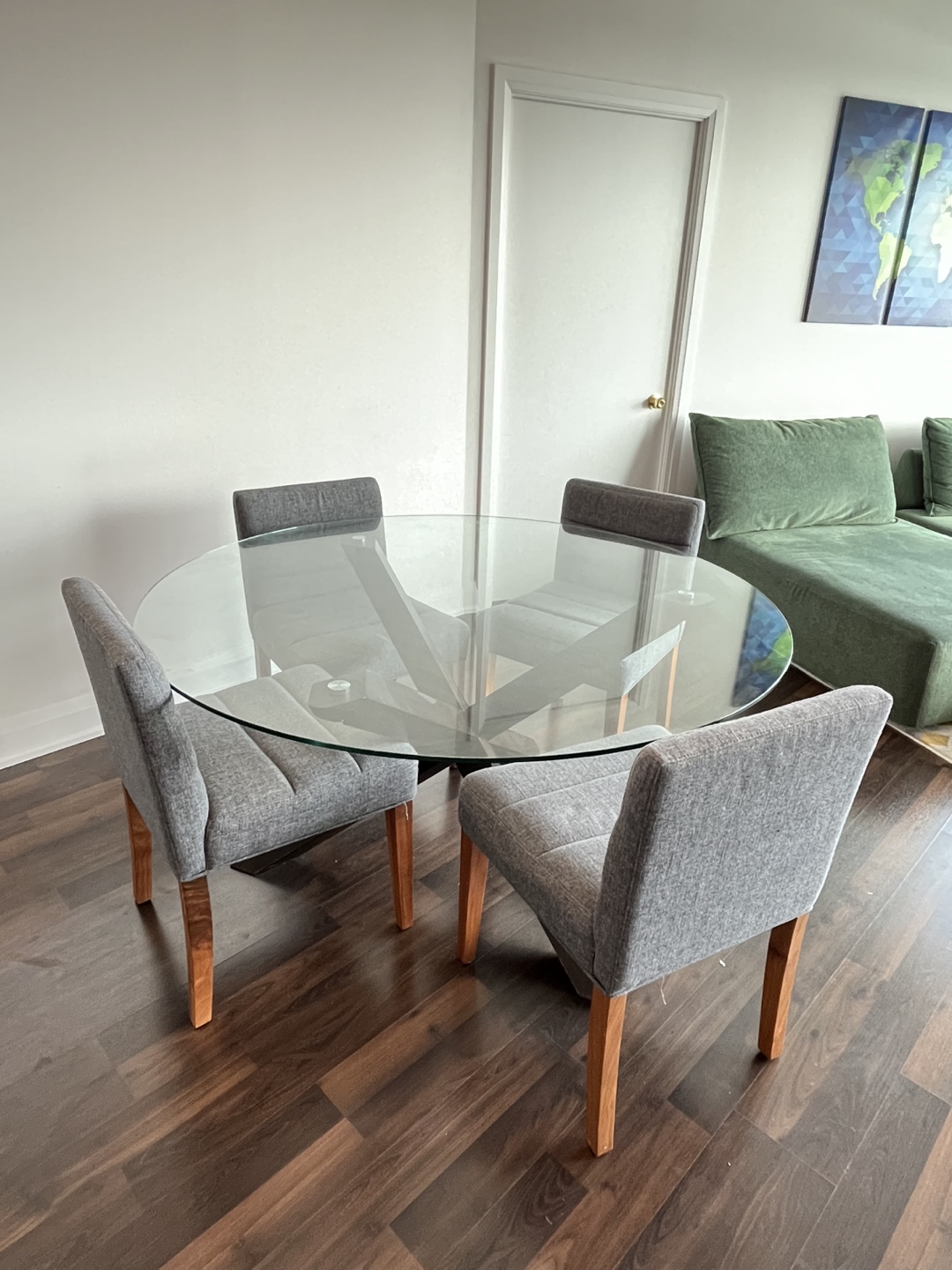 Glass Top Dining Table with Four Grey Chairs