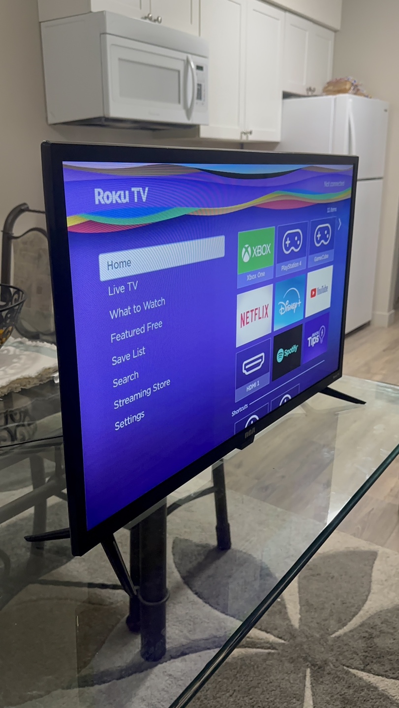 32-inch Roku Smart TV in impeccable condition—it looks like new.