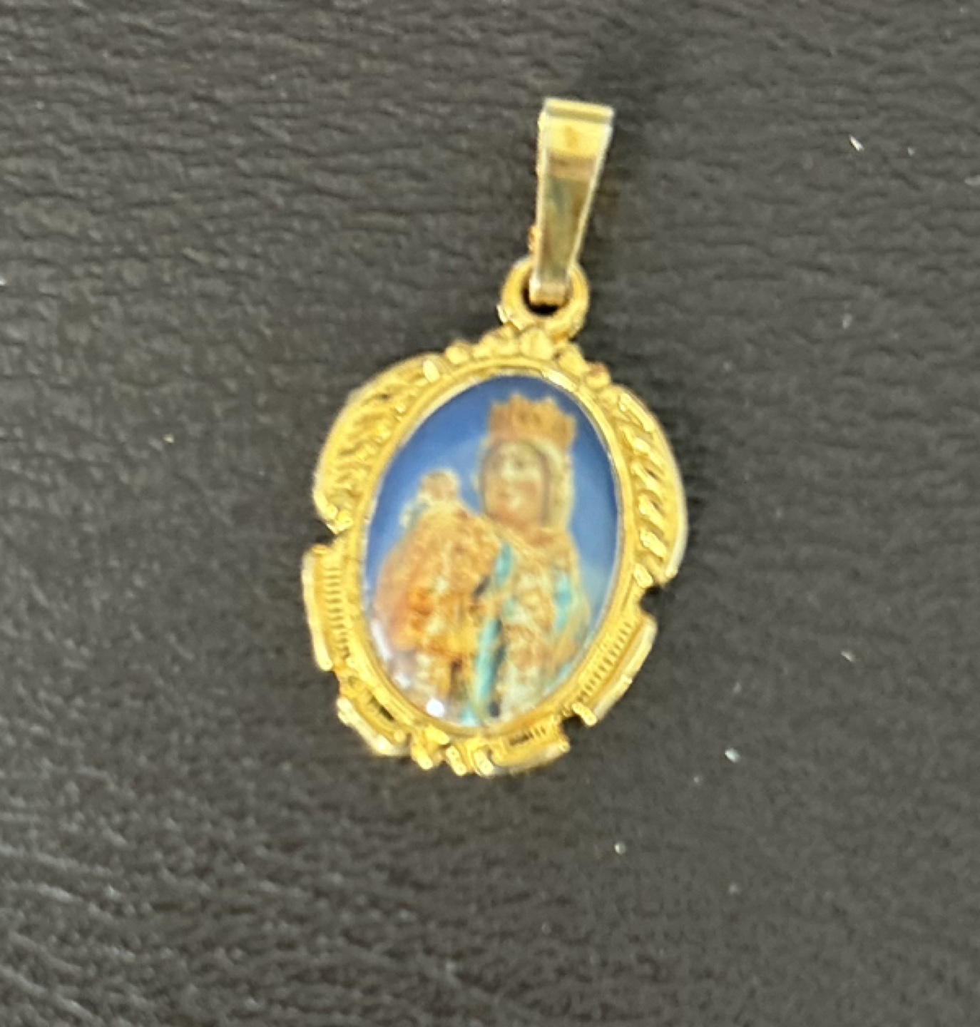 Gold-tone oval religious pendant