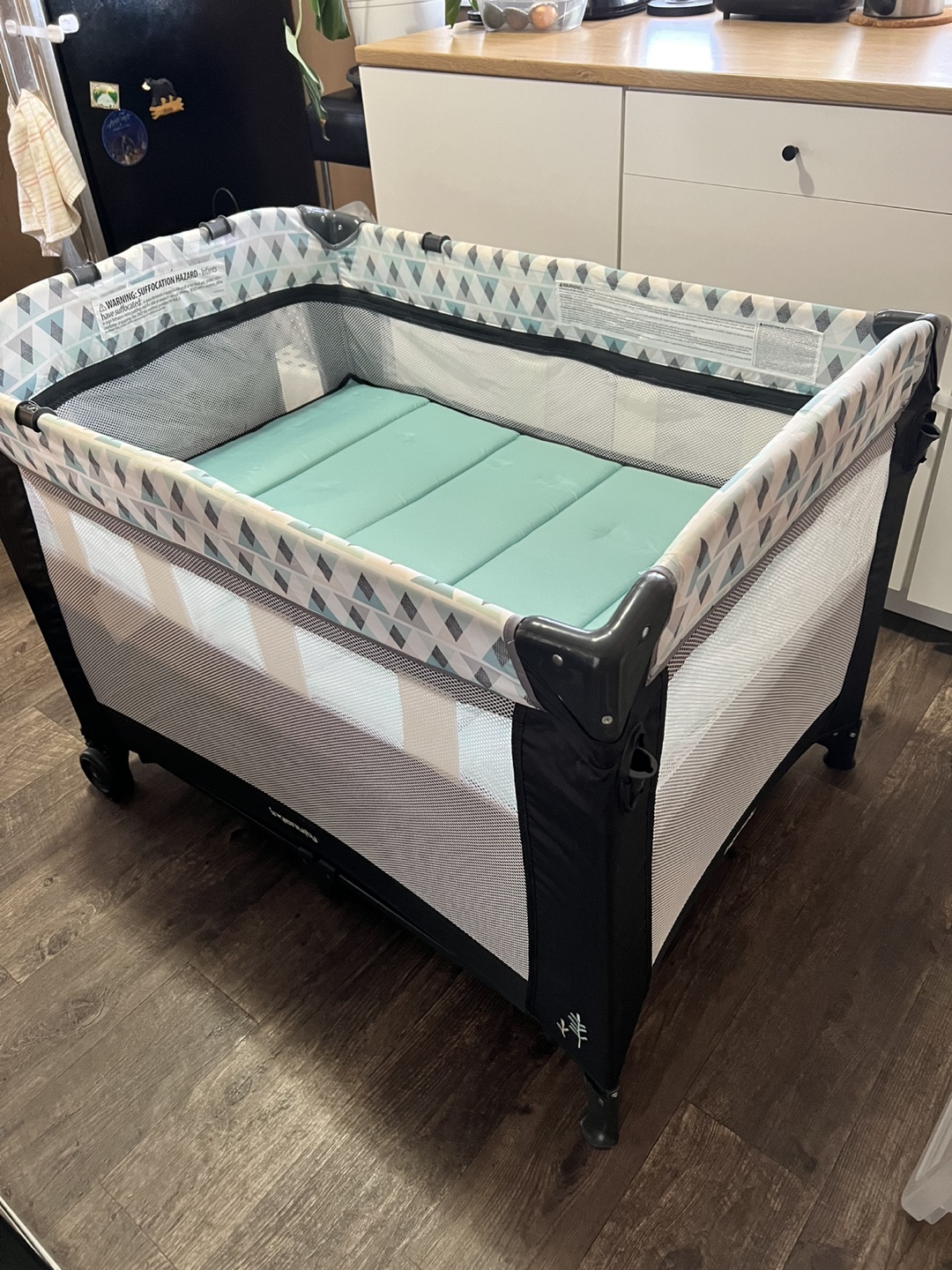 Foldable playard with bassinet and change table