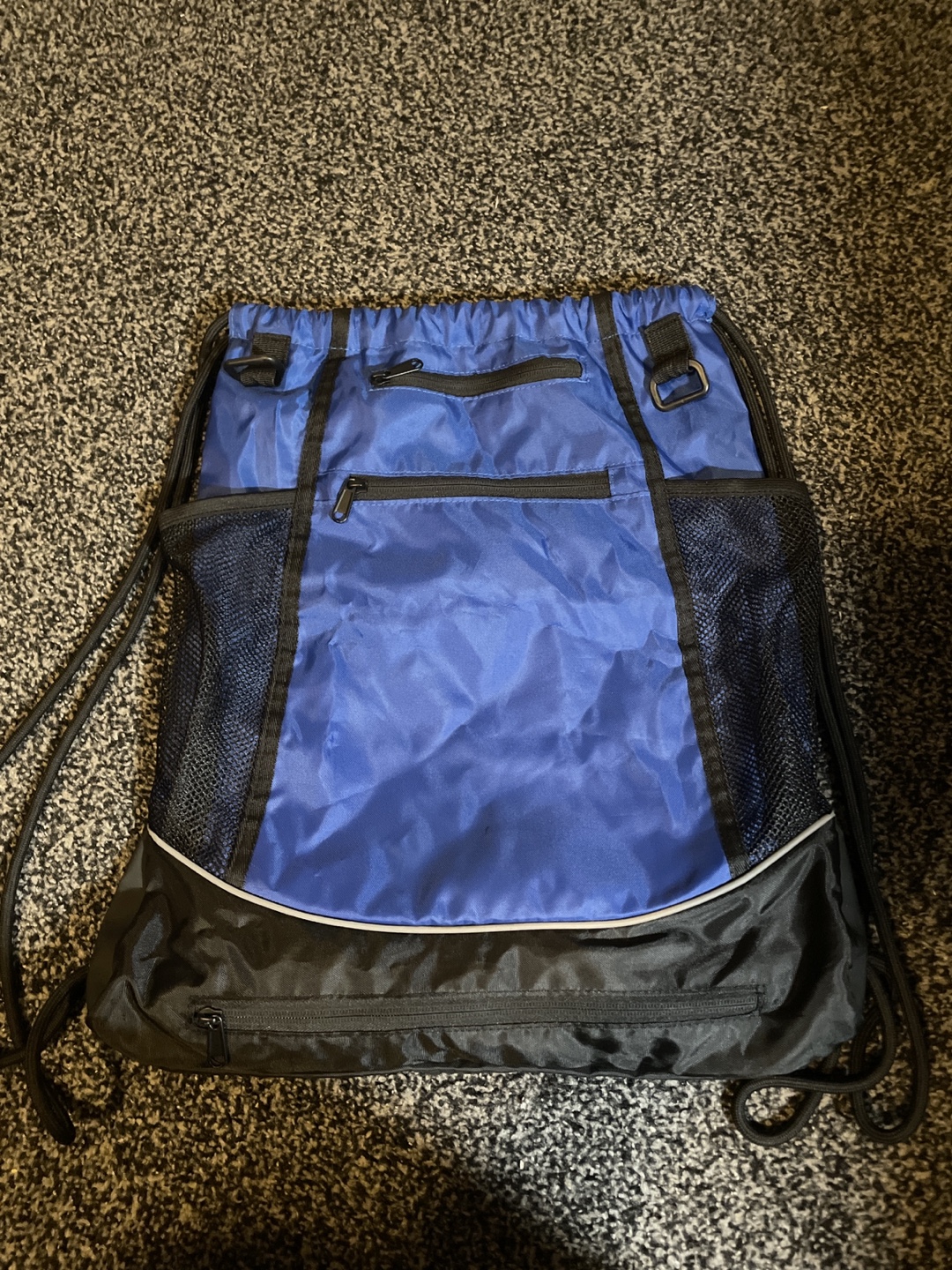 Blue and Black Drawstring Backpack with ball compartment