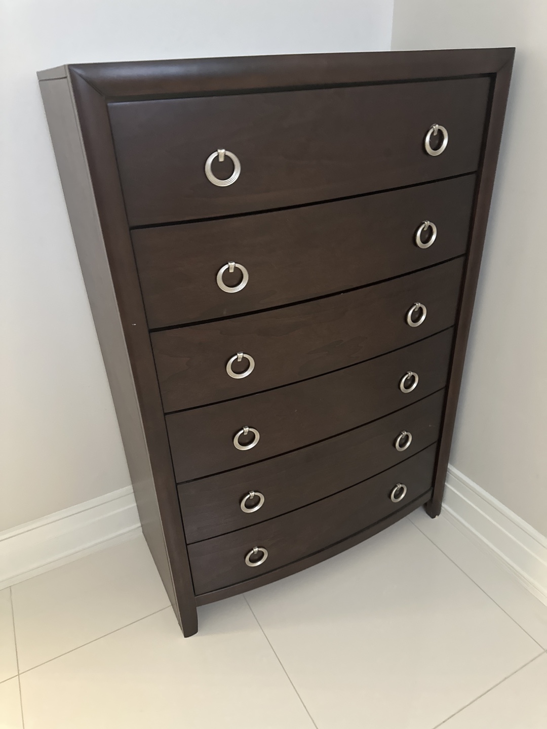 Dark brown wooden tall chest of drawers