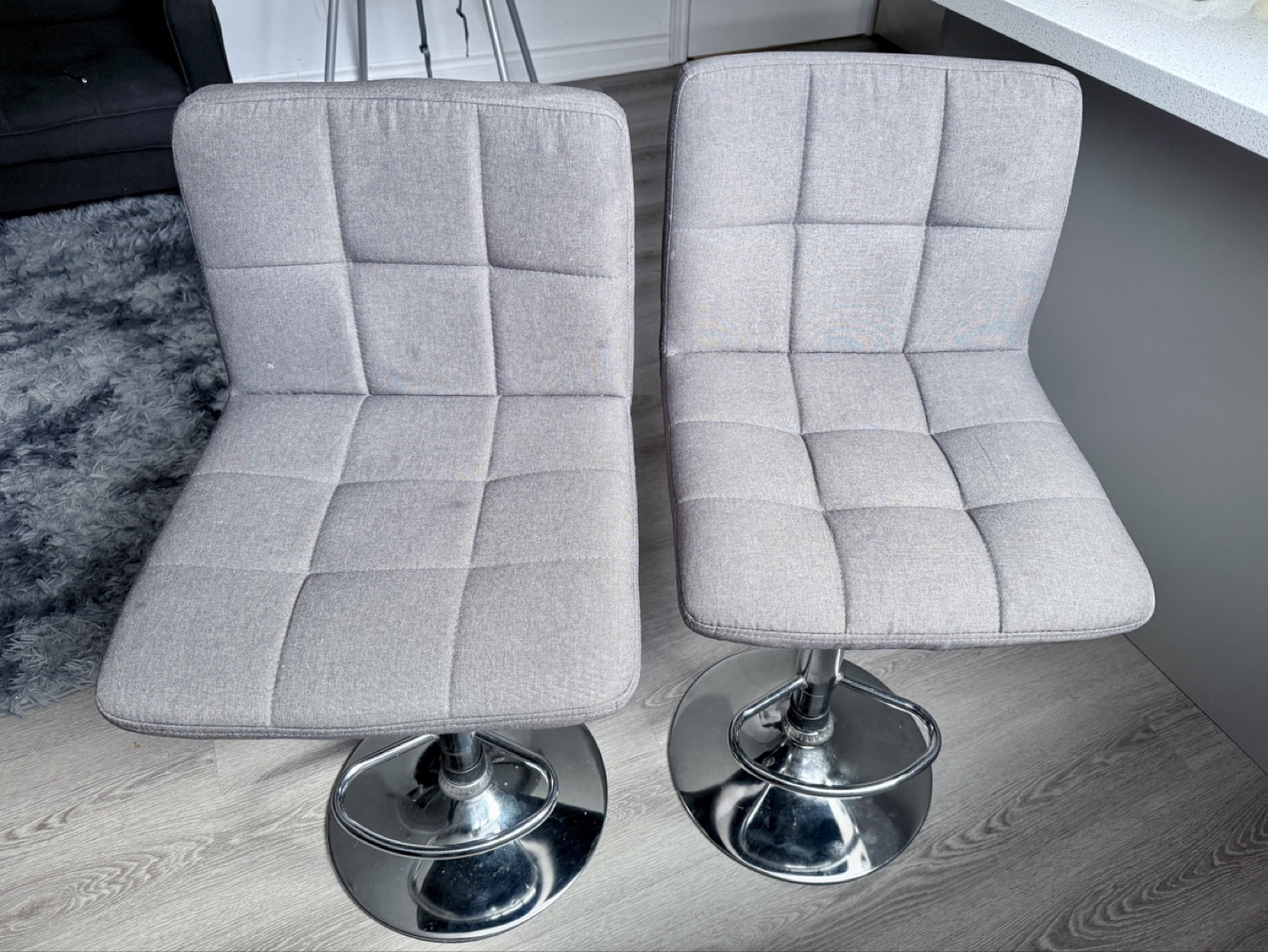 Pair of Grey Fabric Swivel Bar Stools