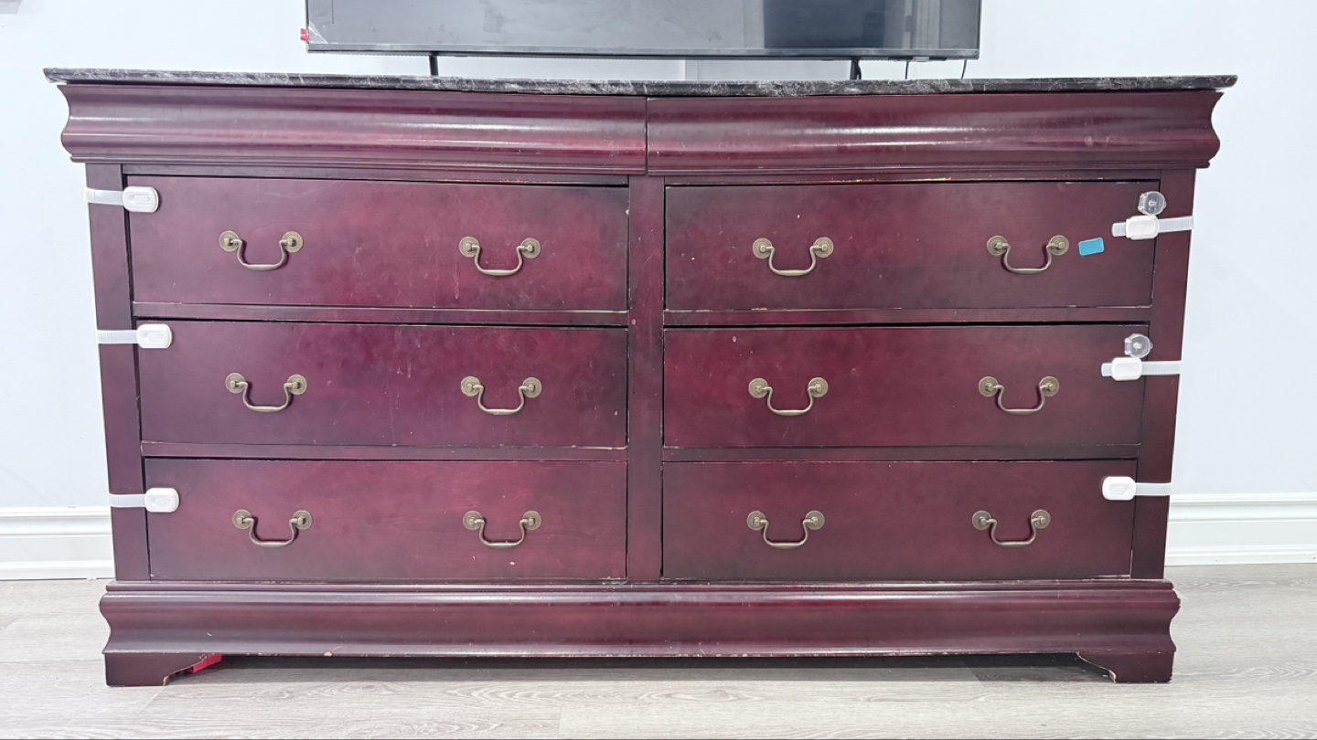 wooden dresser with multiple drawers