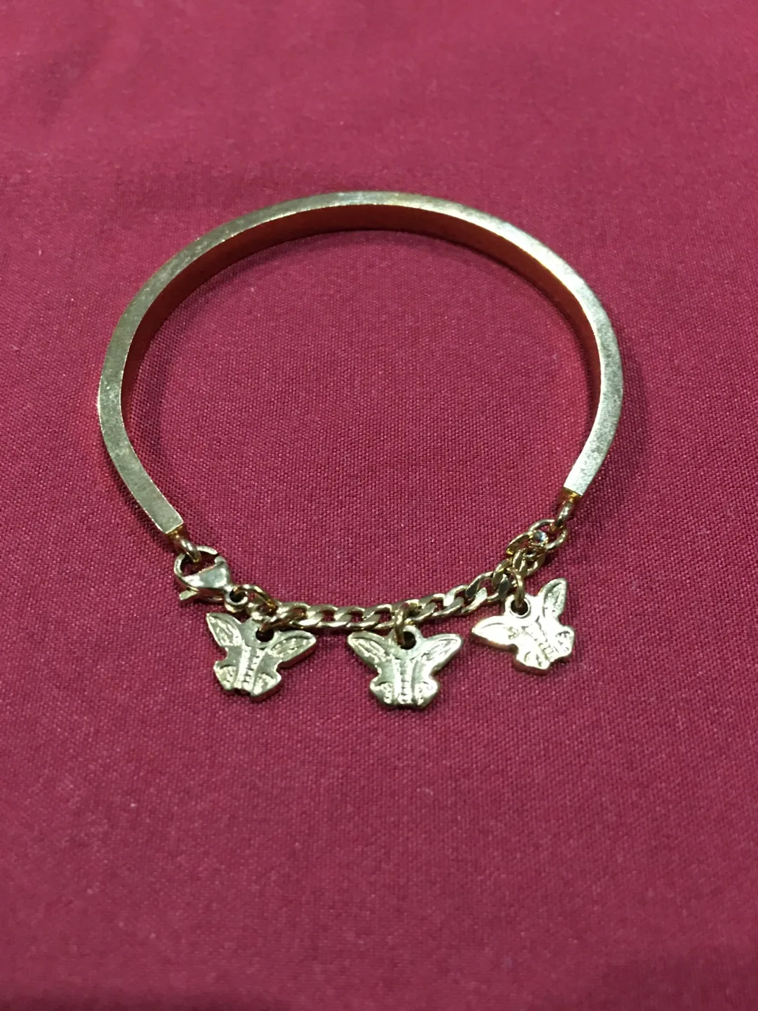 Gold-tone bracelet with butterfly charms image indicator(3)
