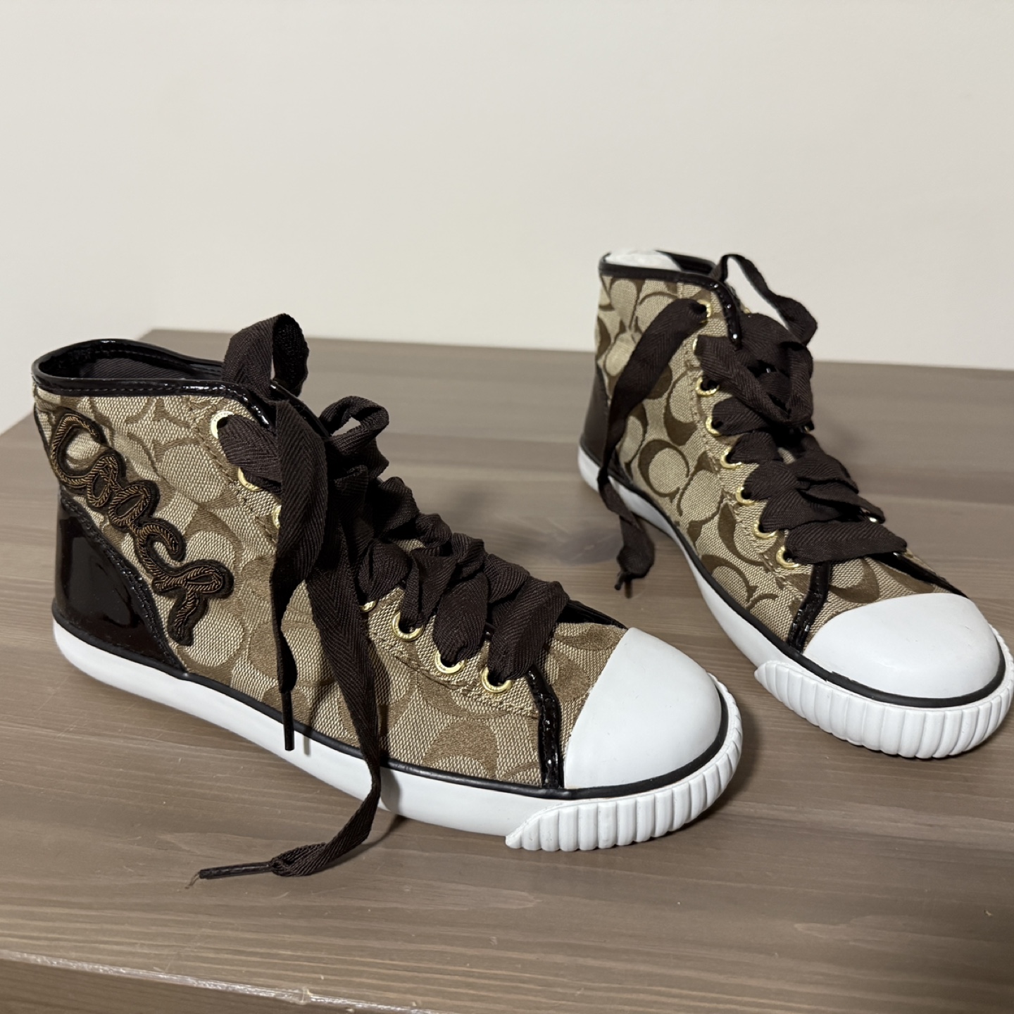 Women's Black and Gold High Heels and Coach High Top Sneakers