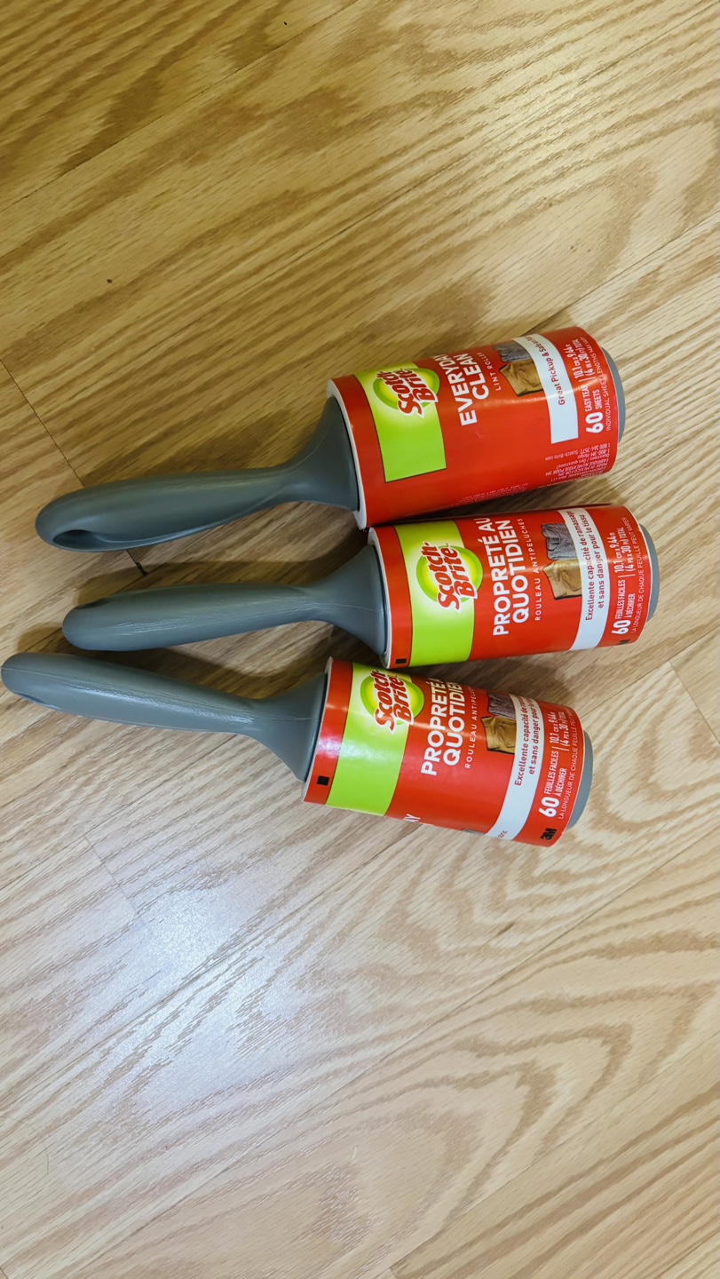 Three Scotch-Brite lint rollers