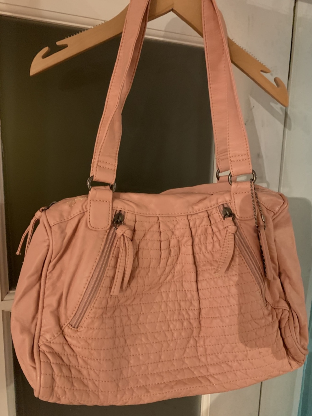 Pink quilted handbag