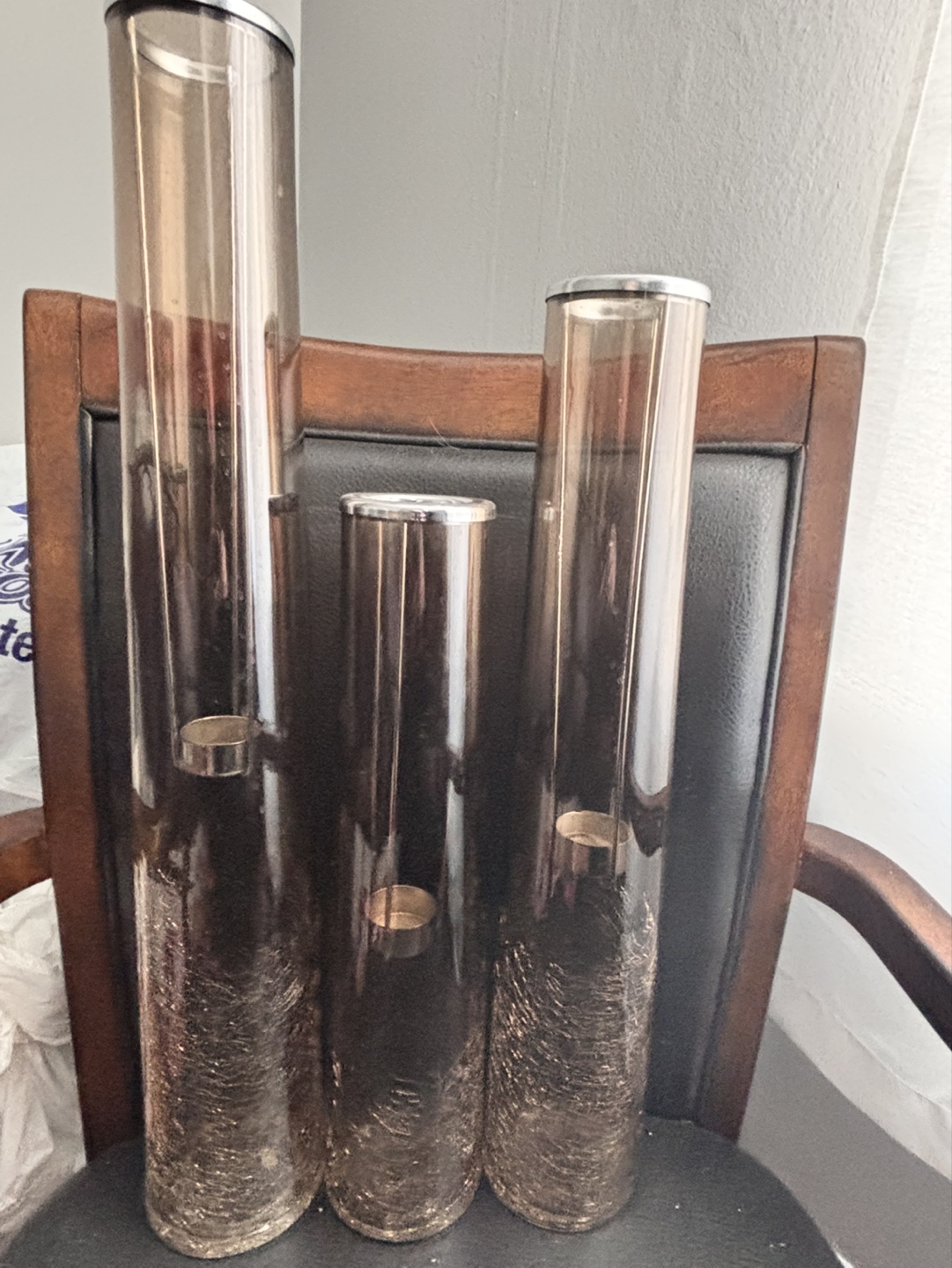 Set of three smoked glass candle holders