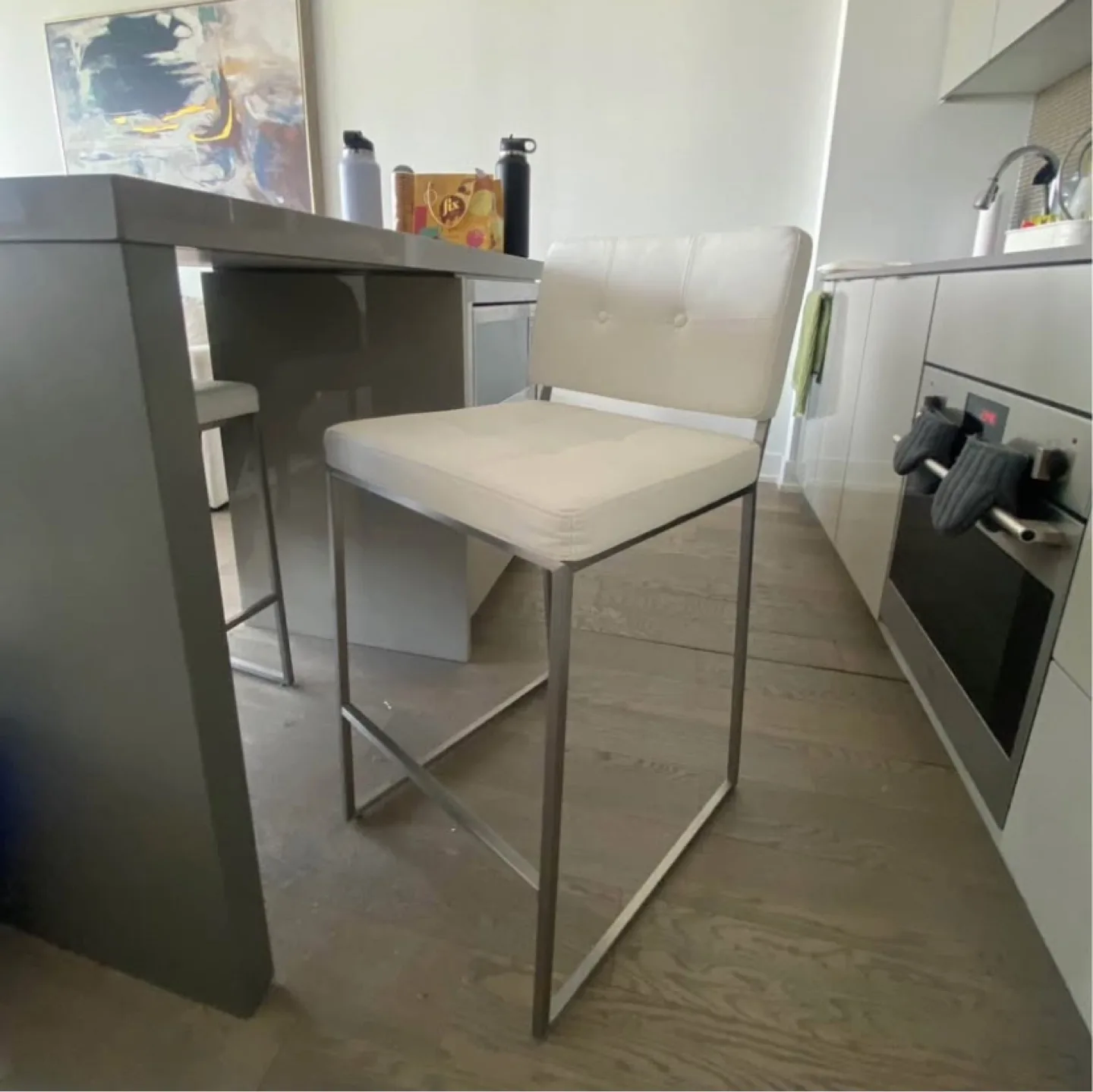 Modern Metal Bar Stool with White Cushioned Seat thumbnail
