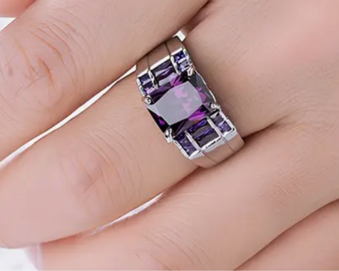 Sterling silver ring with square cut purple gems
