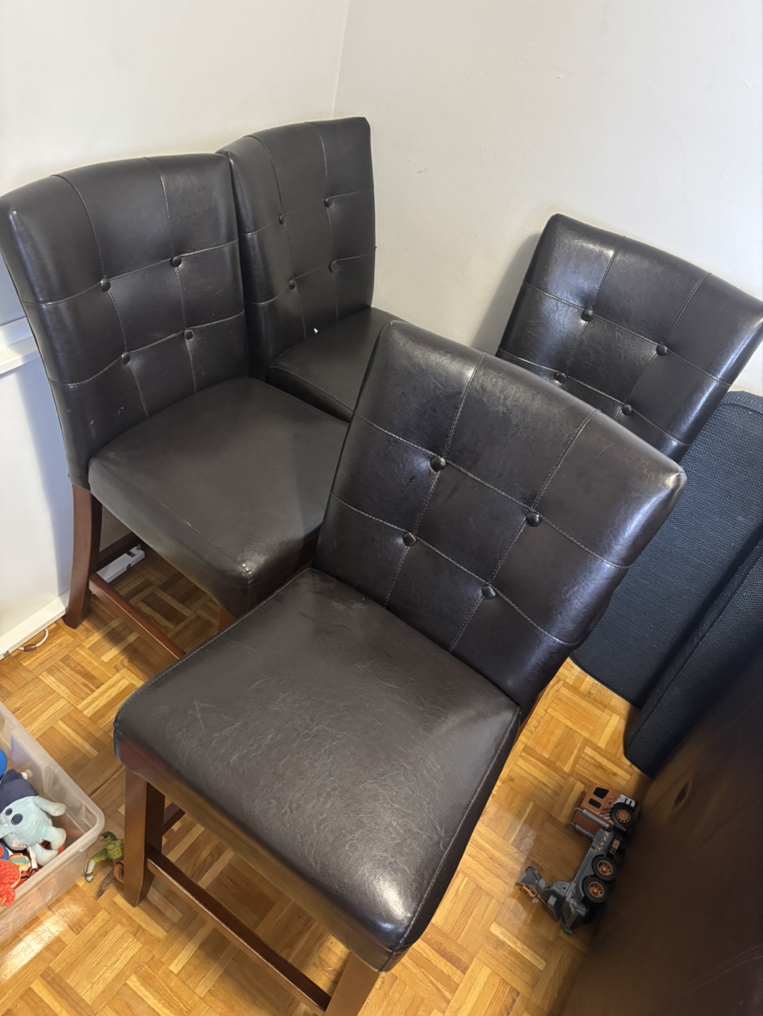 Four Brown Leather upholstered dining or bar-height chairs