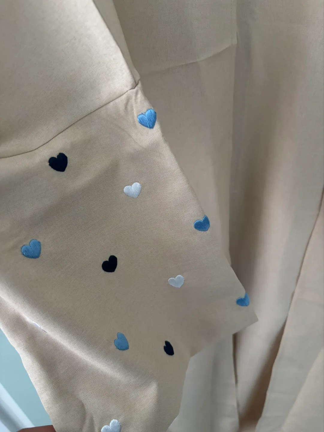 Beige open-front long Abaya with embroidered hearts image indicator(2)