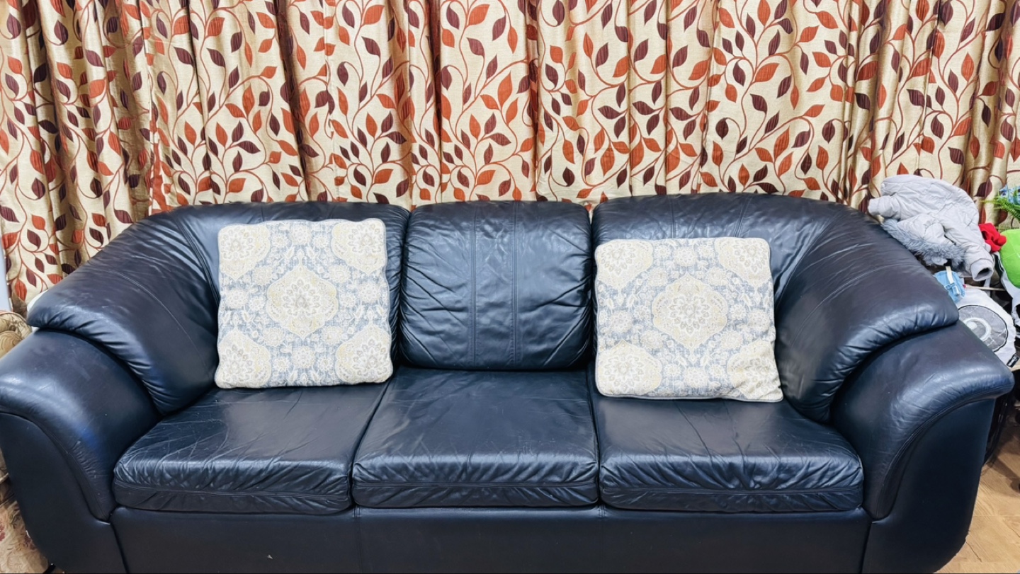 Black Leather Sofa with 2 cusions and a single seater