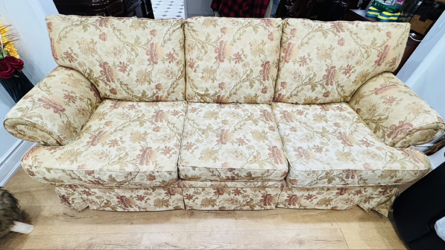 Floral patterned three-seater sofa