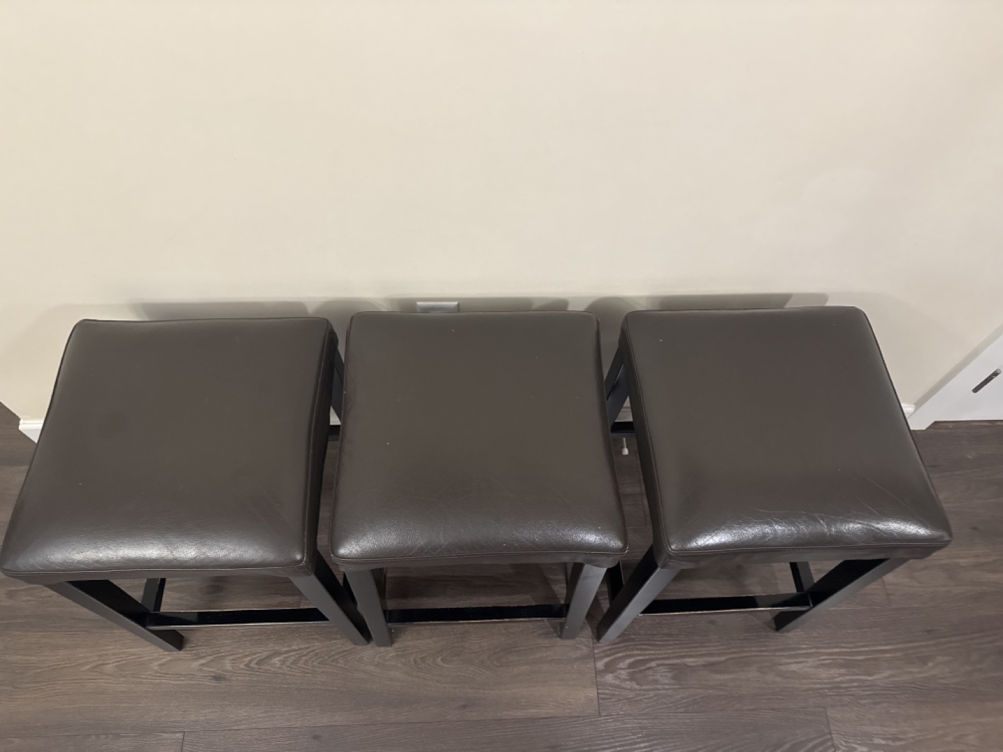 Three Brown Leather Bar Stools