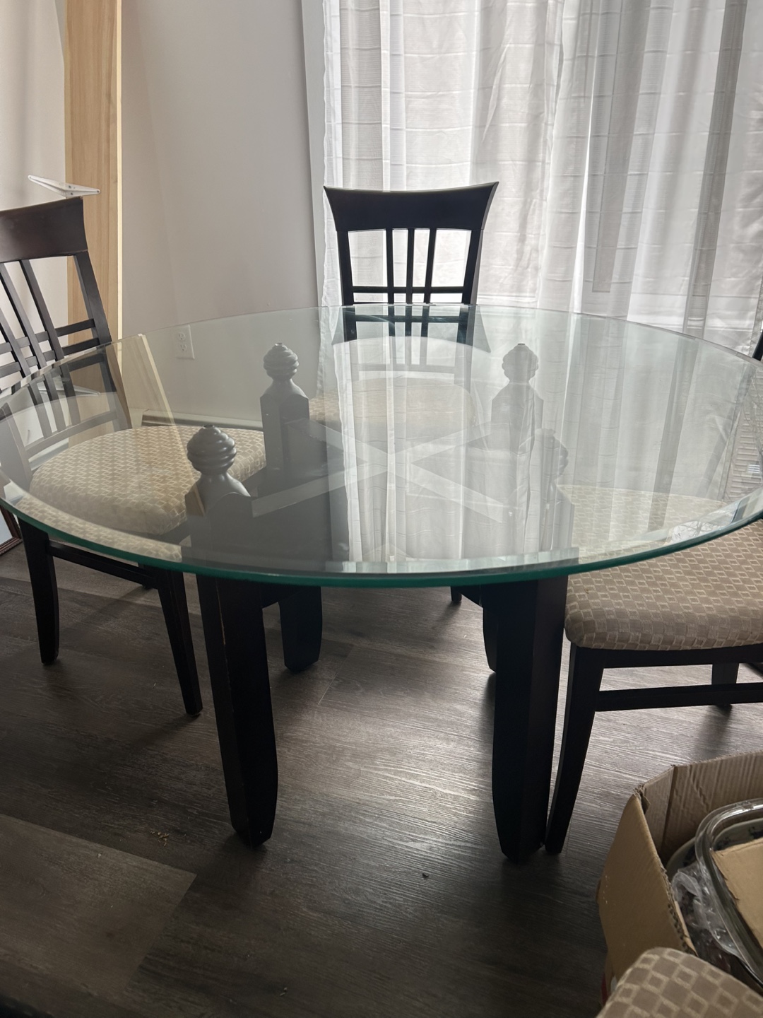 Glass-top dining table and four chairs