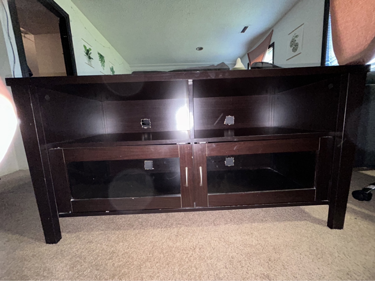 Dark brown TV stand with glass doors