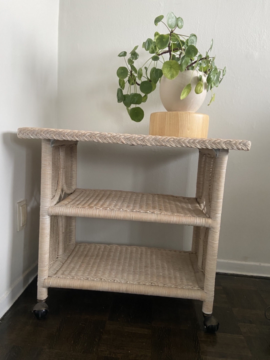 Rolling vintage wicker bar cart