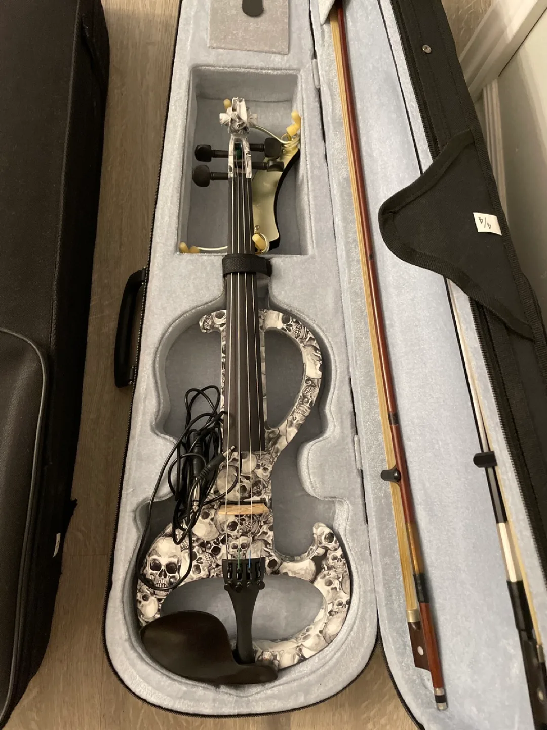 Two violins with cases, accessories, and stand image indicator(2)