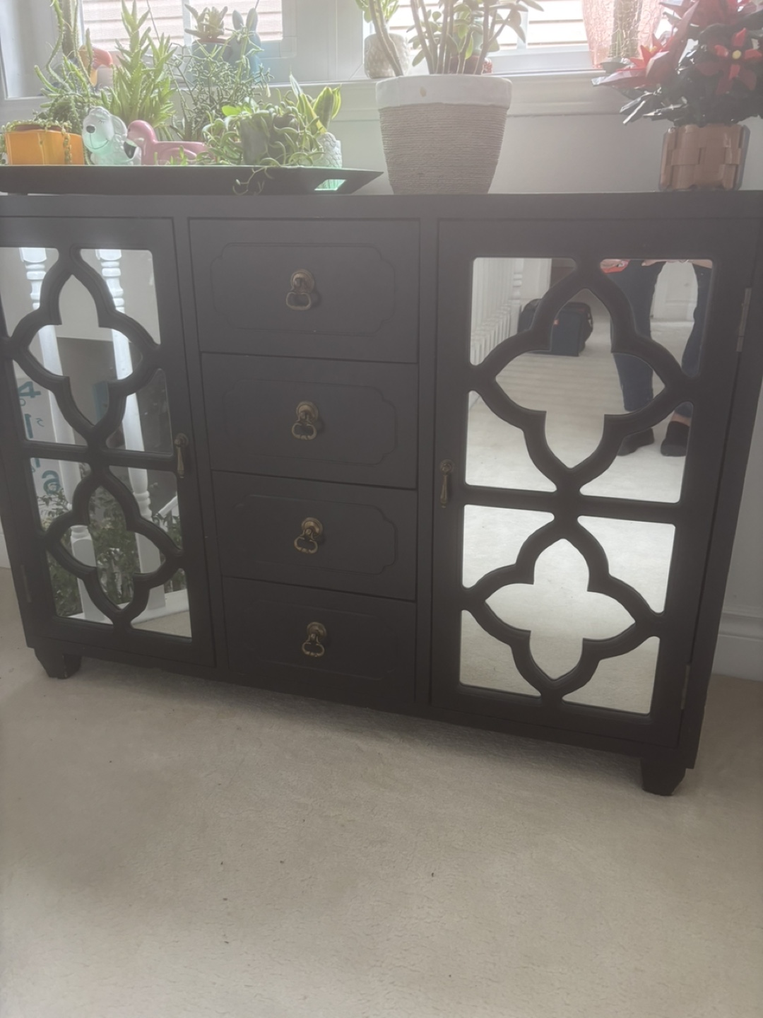 Dark brown mirrored cabinet with four drawers