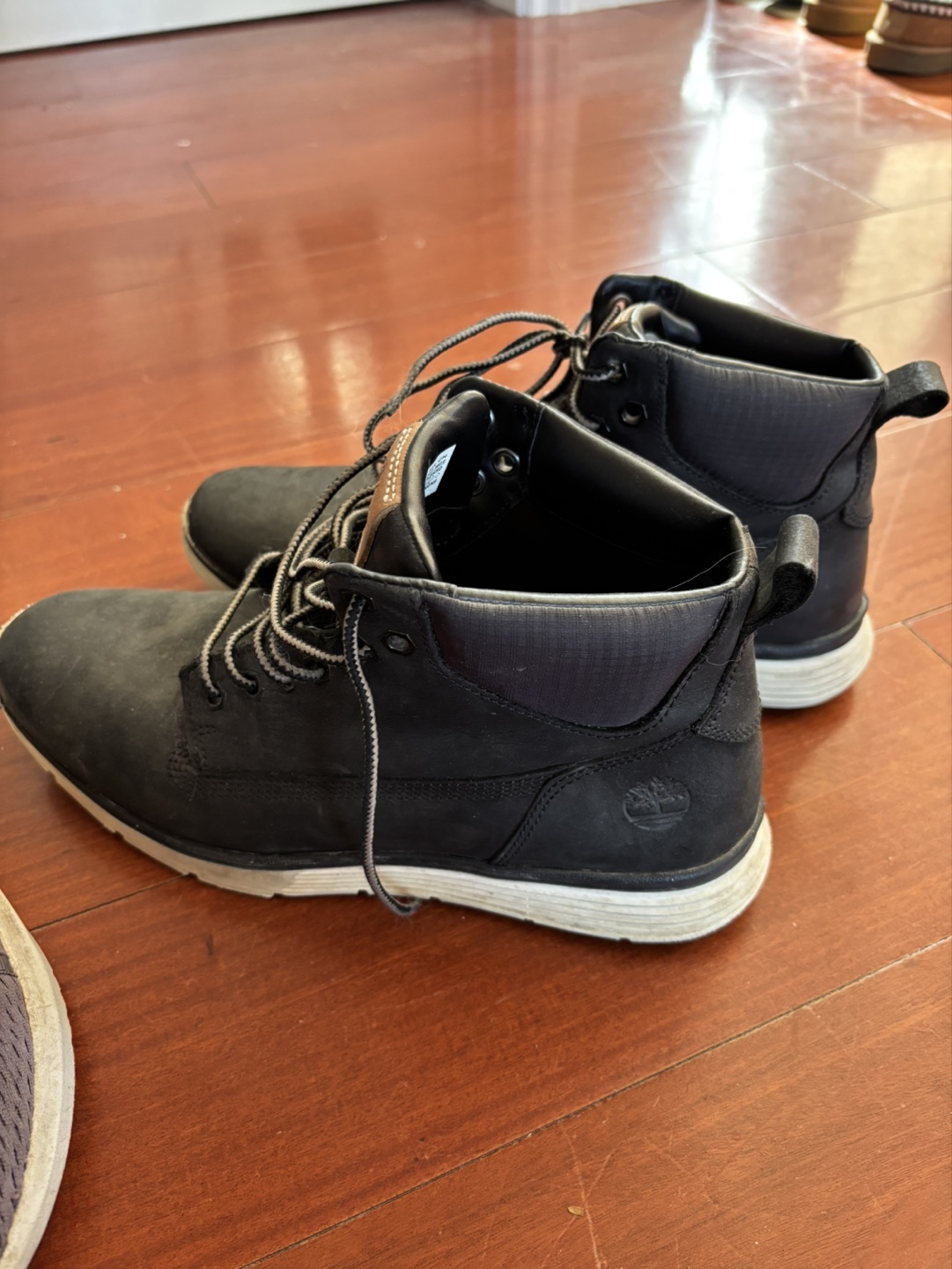Pair of Grey Running Shoes and Black Timberland Boots - photo 3