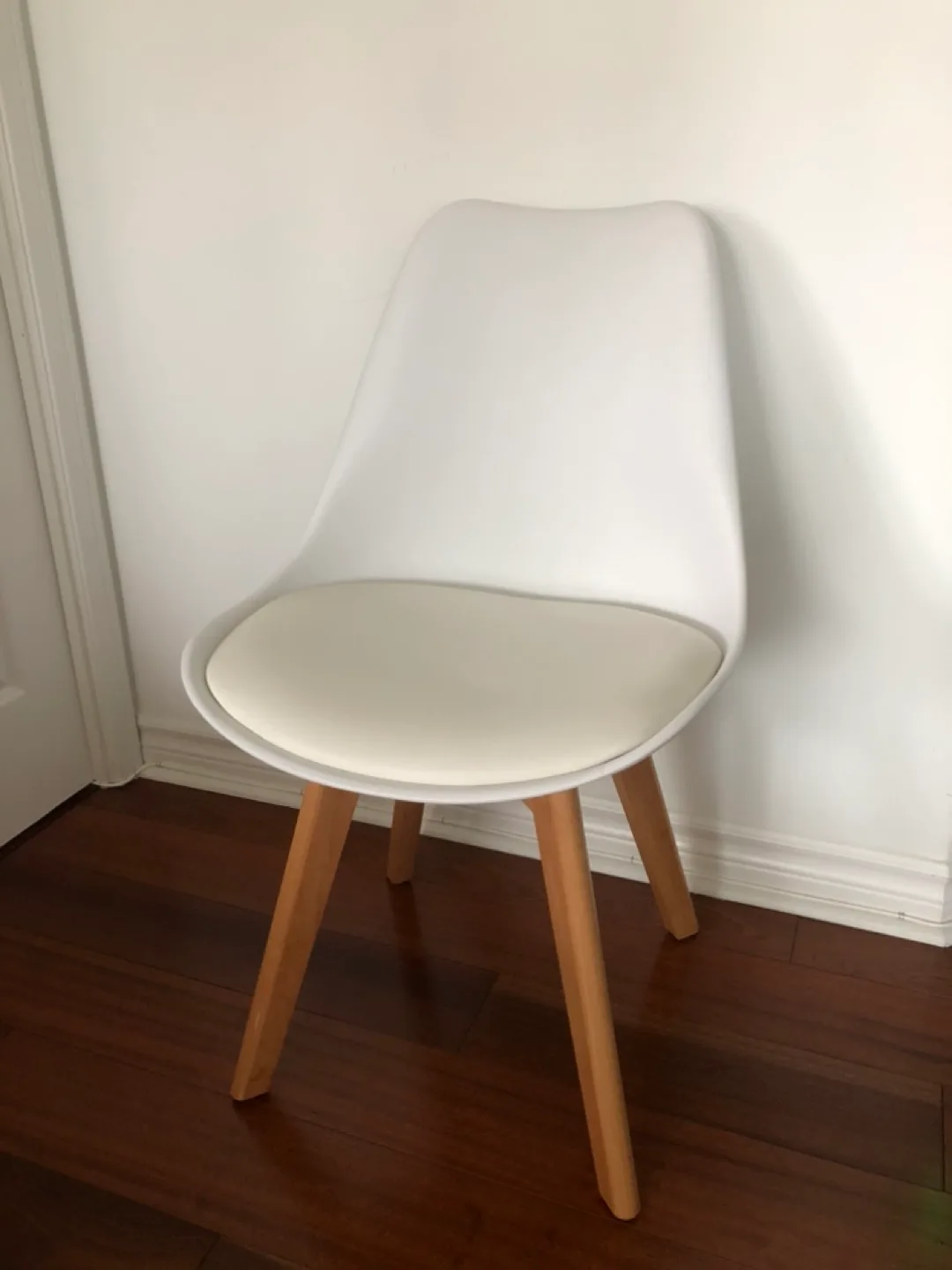 White plastic and wood chair with padded seat thumbnail